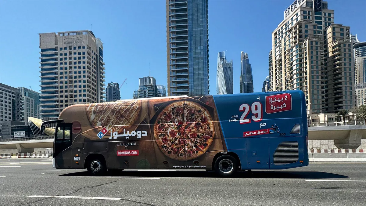 Domino's Pizza Rolls Through Dubai Streets on Buses - Dubai Advertising