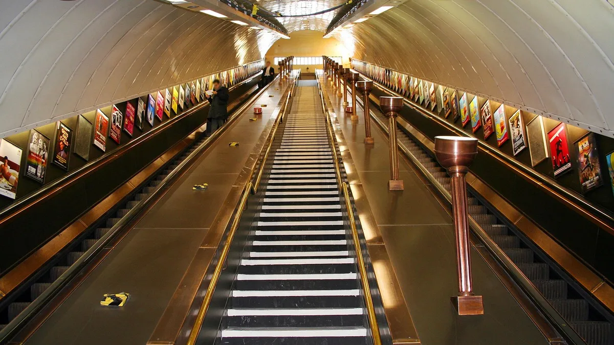 A London Underground Escalator - with advertising posters on the side walls