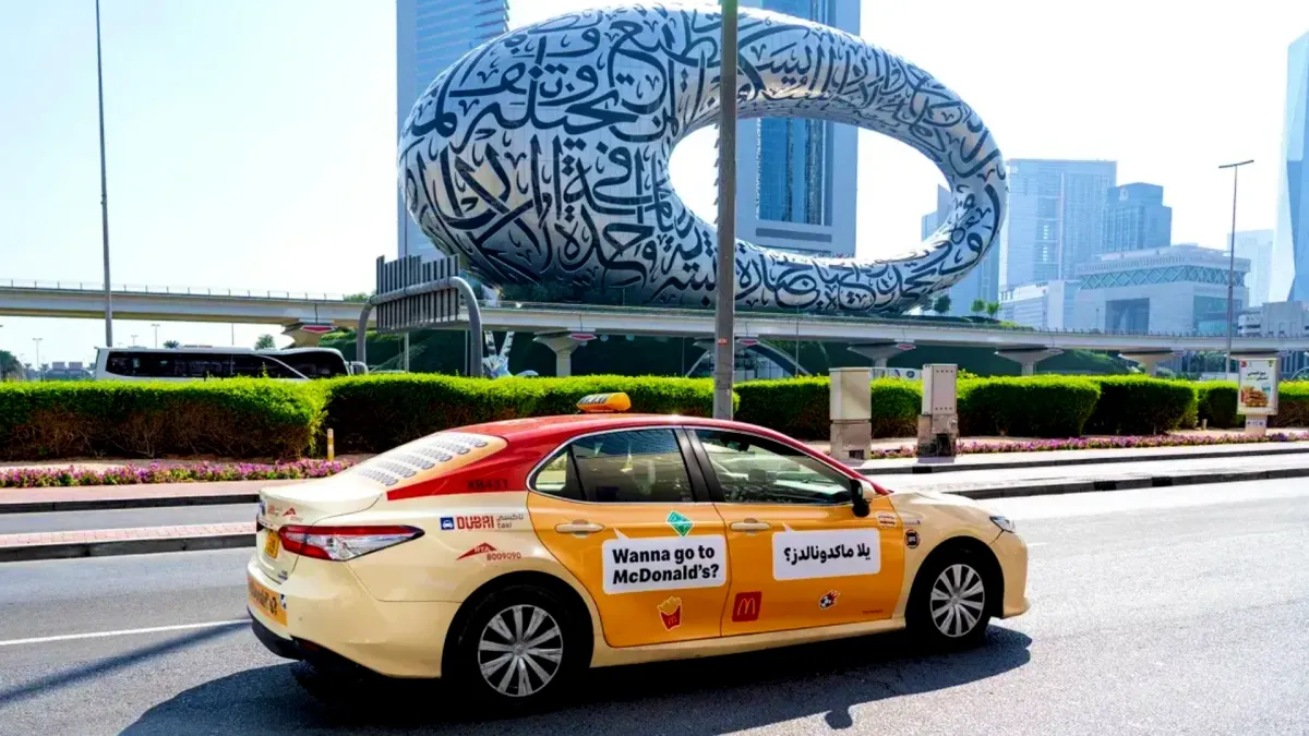 McDonald's Advertising Campaign on a Dubai Taxi next to Museum of the Future - Dubai Taxi Advertising
