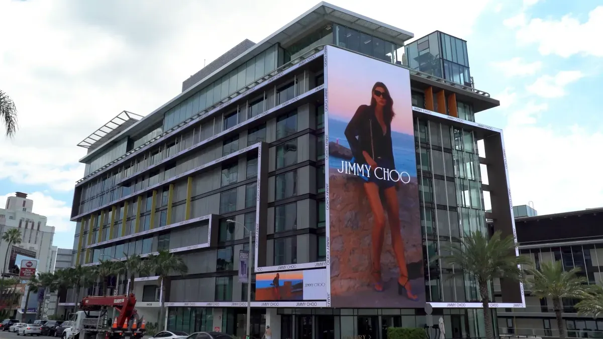 Jimmy Choo Eyewear large-format building wrap advertisement displayed across a prominent city-centre façade in New York.