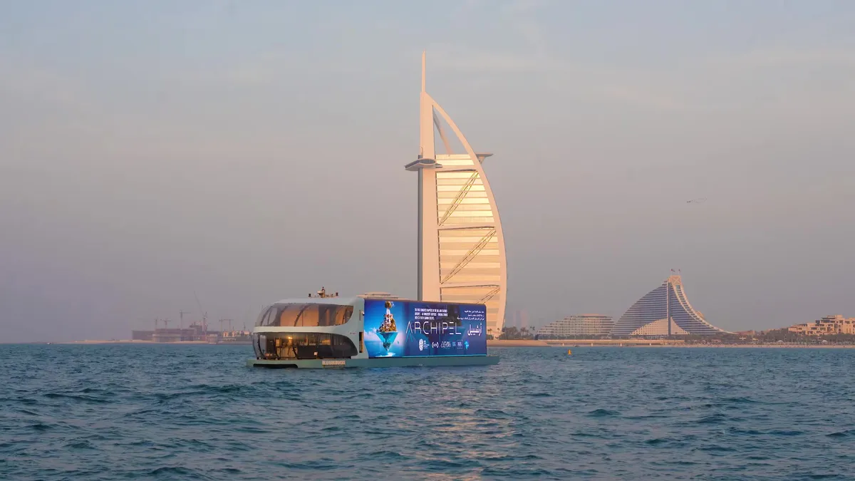 A floating billboard going past the Burj Al Arab