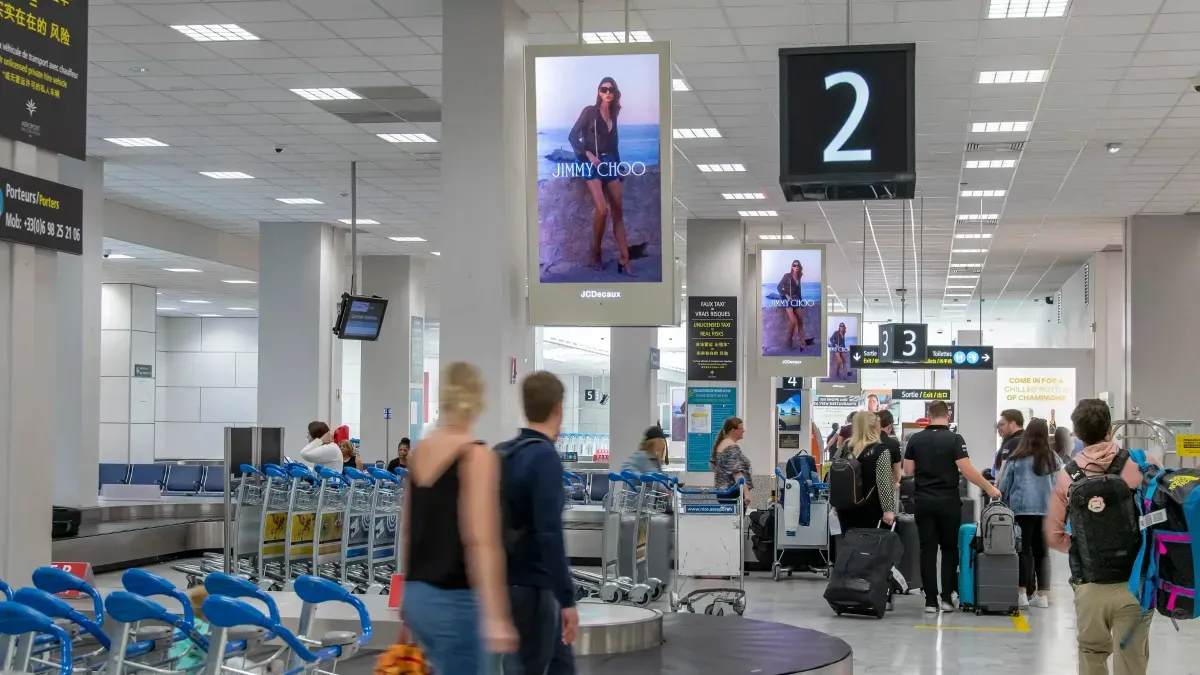 Jimmy Choo Eyewear digital advertising displayed throughout Shanghai International Airport baggage reclaim area, reaching arriving passengers and international travellers.