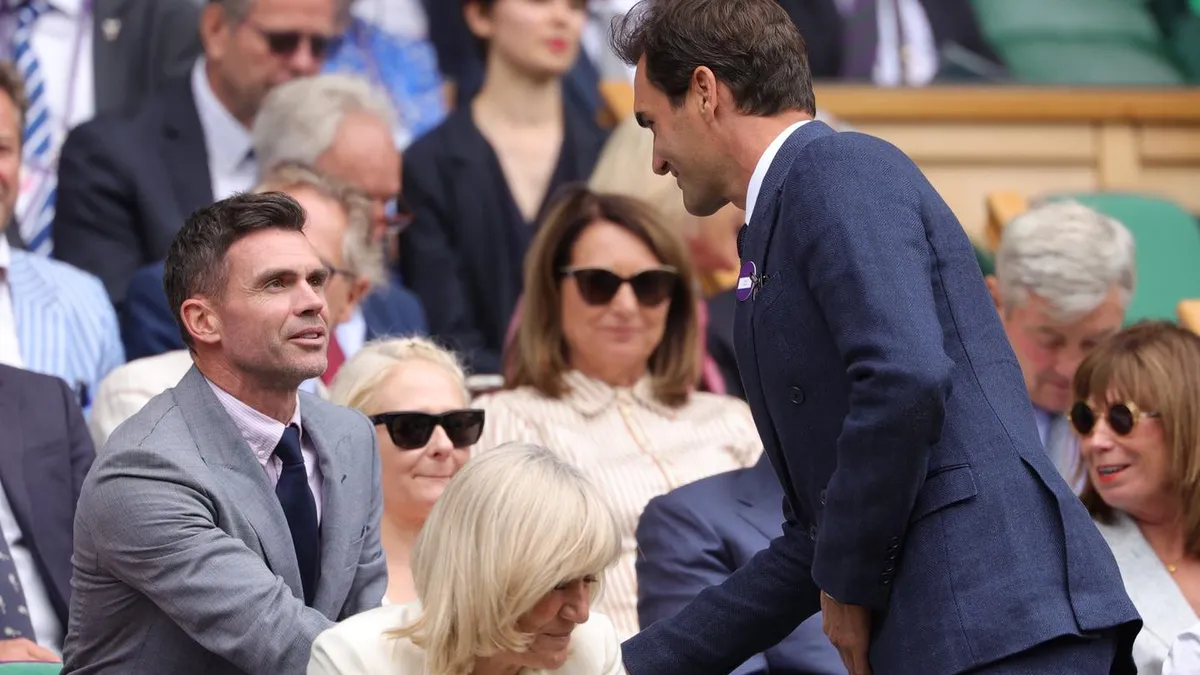 Roger Federer shakes hand with Sir James Anderson - World Sports Advertising
