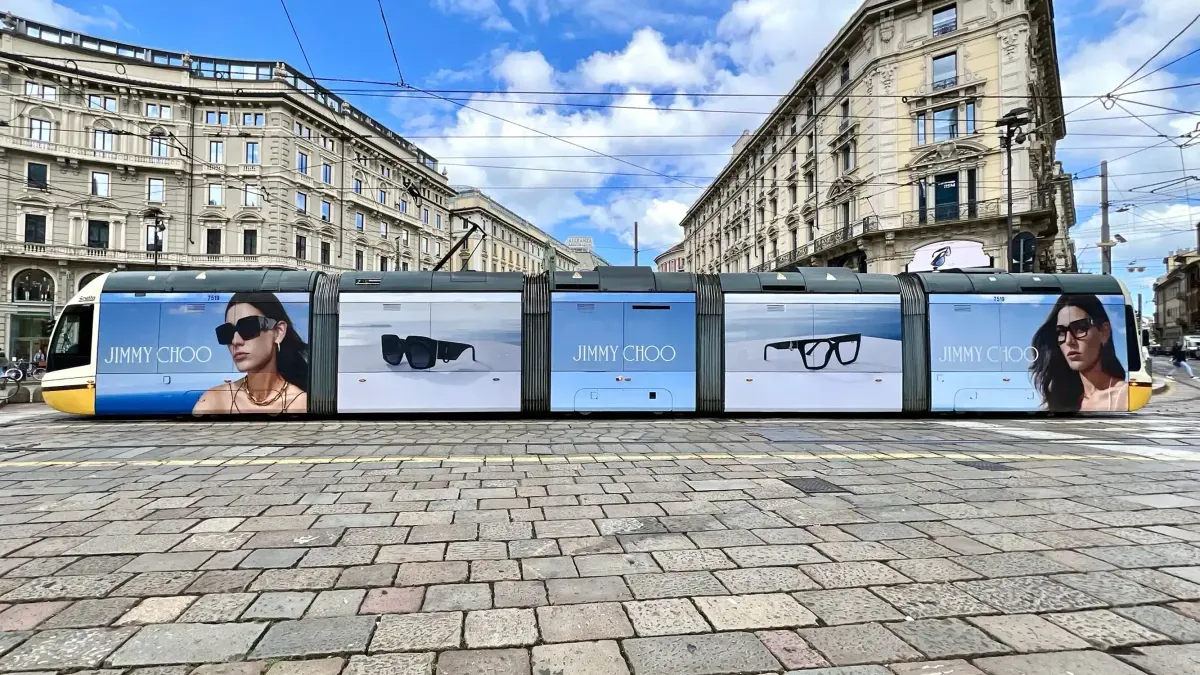 Jimmy Choo Eyewear advertising campaign displayed across a wrapped tram on the streets of Milan, Italy.