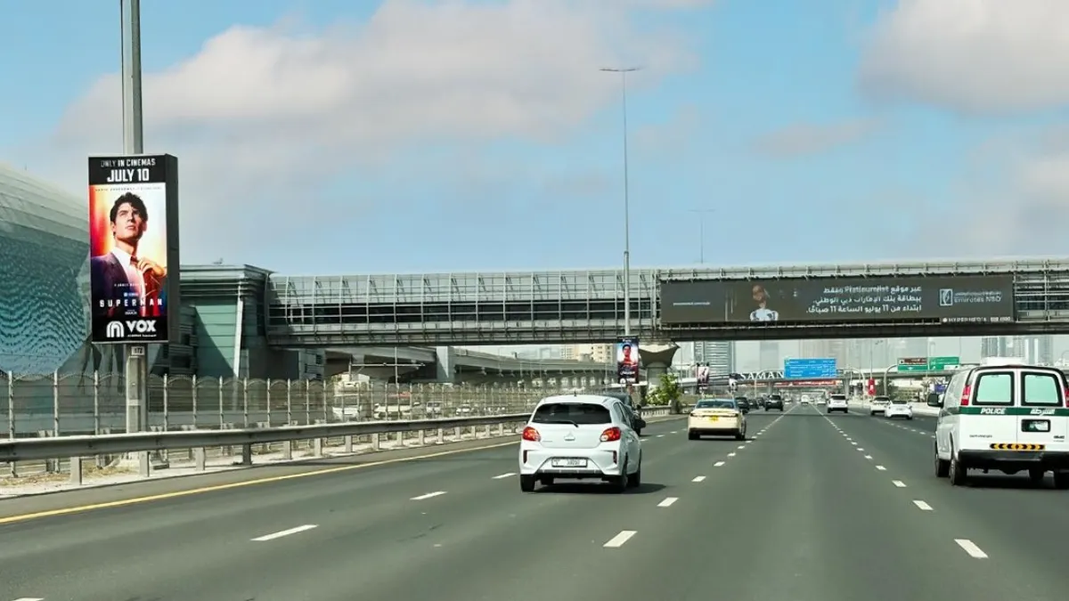 Superman Lamppost Ad in Dubai Sheikh Zayed Road - Dubai Advertising